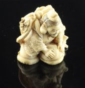 A Japanese ivory netsuke of an immortal crouching on an octopus, Meiji period, possibly depicting
