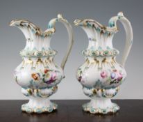 A pair of English porcelain jugs, probably Coalport, circa 1835, painted with flowers and