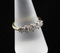 An 18ct gold and graduated five stone diamond ring, size P.