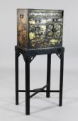 A Japanese Meiji period black lacquer collector`s chest, fitted with an arrangement of doors and