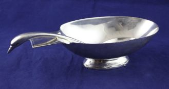 A 1930`s Art Deco Christofle Gallia silver plated sauceboat and swan neck ladle, designed by