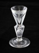 A George I toastmaster`s glass, c.1715, with deceptive conical bowl set on a silesian tear drop