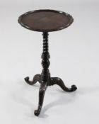 A George III Irish Chippendale mahogany wine table, with dished top, spiral fluted stem and scroll