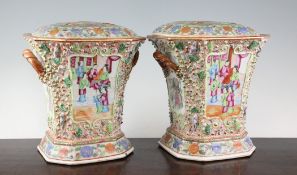 A pair of Chinese Canton decorated famille rose bough pots, Daoguang period, each painted with
