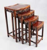 A Chinese nest of burr wood and hardwood quartetto tables, with foliate pierced friezes, 1ft 8in.