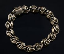 A gold multi ring link bracelet, 32.4 grams.