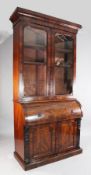 A Victorian mahogany cylinder bureau bookcase, fitted two glazed doors with slide out interior