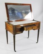 A 19th century French brass banded mahogany tableau de toilette, with rising top opening to reveal a