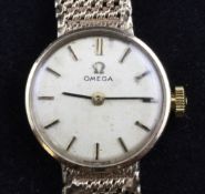 A lady`s mid 1960`s 9ct gold Omega manual wind wrist watch, with baton numerals, movement c.620,