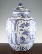 A large Chinese blue and white jar and cover, Ming dynasty, Wanli period, painted with reserves of