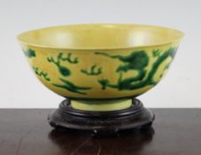 A Chinese yellow glazed `dragon` bowl, Kangxi mark, Republic period, decorated with incised green