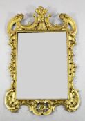 An 18th century carved giltwood wall mirror, with pierced acanthus and C scroll decoration and