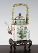 A Chinese famille verte wine pot and cover, Kangxi period, painted with baskets of flowers,