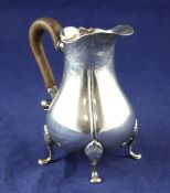 A late 18th century Dutch silver cream jug, of pear form, with engraved foliate decoration and