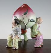 A Chinese coloured biscuit and enamelled porcelain group, mid 20th century, modelled as three boys