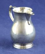 A George II silver sparrowbeak cream jug, of baluster form, with scroll handle, Richard Gurney &