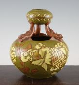 A C.H. Brannam twin section pottery vase, by James Dewdney, c.1894, with a globular bowl supported