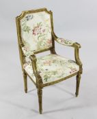 An unusual Louis XVI design carved giltwood child`s open armchair, with floral patterned seat and