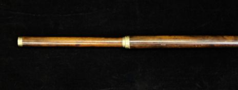 An unusual early 19th century malacca walking cane, with engraved gold mounts, the end monogrammed