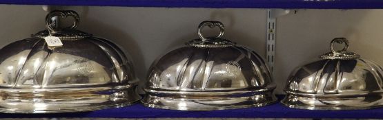 A graduated set of three 19th century silver plated meat dish covers, of oval form, engraved with