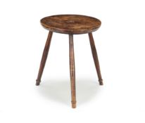 A GEORGE IV ASH CRICKET TABLE, EARLY 19TH CENTURY, the moulded single plank top with a central