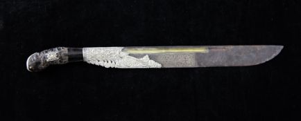 A 19th century Ceylonese pia ketta dagger, with silver mounts and carved horn handle, 11in.