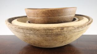 A large elm bowl and three others, 20in.