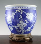 A large Chinese blue and white jardiniere, 19th century, painted with prunus blossom on a blue