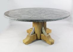 A large decorative circular dining table, with pinned lead covered top, W.5ft 7in.