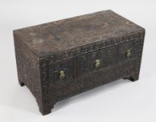 An unusual profusely carved rectangular low stand or chest, probably Indian, c.19th century,