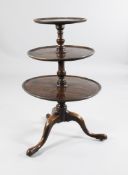 A George III mahogany graduated three tier dumb waiter, on tripod base, H.3ft 2.5in.