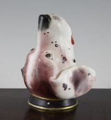 A Staffordshire porcelaneous stirrup cup, mid 19th century, modelled as the head of a fox hound,