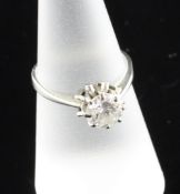 An 18ct white gold solitaire diamond ring, the round brilliant cut stone weighing approximately 1.