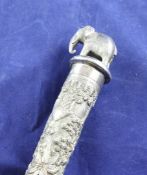 A 20th century Indian white metal toasting fork, with elephant finial and tapering handle embossed