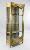 A Louis XVI style carved giltwood display cabinet, with glazed sides and single glass panel door