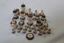 A late 19th century Islamic Muslim pattern bone chess set, decorated with typical red and black