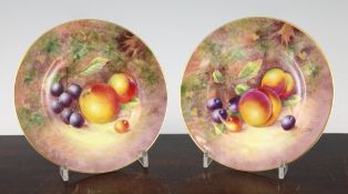 A pair of Royal Worcester fruit painted side plates, signed V.Cook, c.1960, black printed and