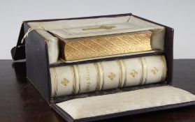 A Victorian gilt tooled and vellum bound Holy bible and matching Common Prayer book, both printed to