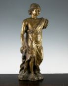 A 17th century European carved and gilded wood figure of a young male, dressed in robes, on a