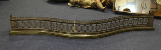 A George III serpentine pierced steel and brass fender, 4ft 11in.