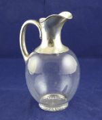 An Edwardian Scottish silver mounted glass claret jug, of plain ovoid form, Brook & Son?, Edinburgh,