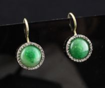 A pair of gold, cabochon jadeite and diamond set earrings, of disc form, overall 1in.
