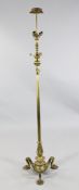 An early 20th century Continental gilt brass lamp standard, with three lights, stiff leaf decoration