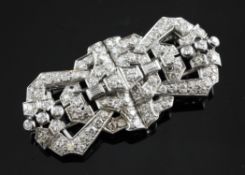 A French Art Deco 18ct white gold and diamond set double clip brooch, of shaped rectangular form,
