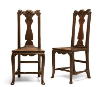 A PAIR OF GEORGE I OAK DINING CHAIRS, CIRCA 1720, the moulded eared top rails above vase shaped