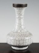 A Chinese crackle glaze bottle vase, with brown key fret and wave borders, 8in. (20.3cm)