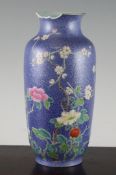 A Chinese famille rose blue ground vase, Qianlong mark, Republic period, painted with flowers and