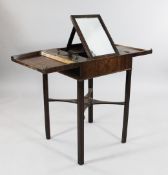 A George III mahogany and chequer inlaid fold-out gentleman`s dressing table, the hinged top opening