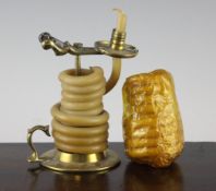 A George III brass wax jack, with scissor action and looped handle, on circular base, together