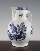 A Worcester mask jug, c.1775, printed in blue with the parrot pecking fruit pattern, shaded crescent